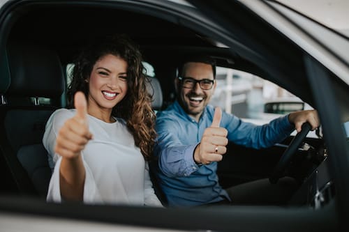 Happy,Middle,Age,Couple,Enjoying,While,Choosing,And,Buying,New